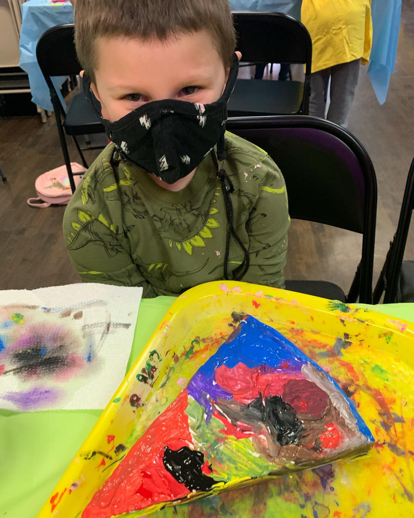 Boy in mask with pizza plaster painting