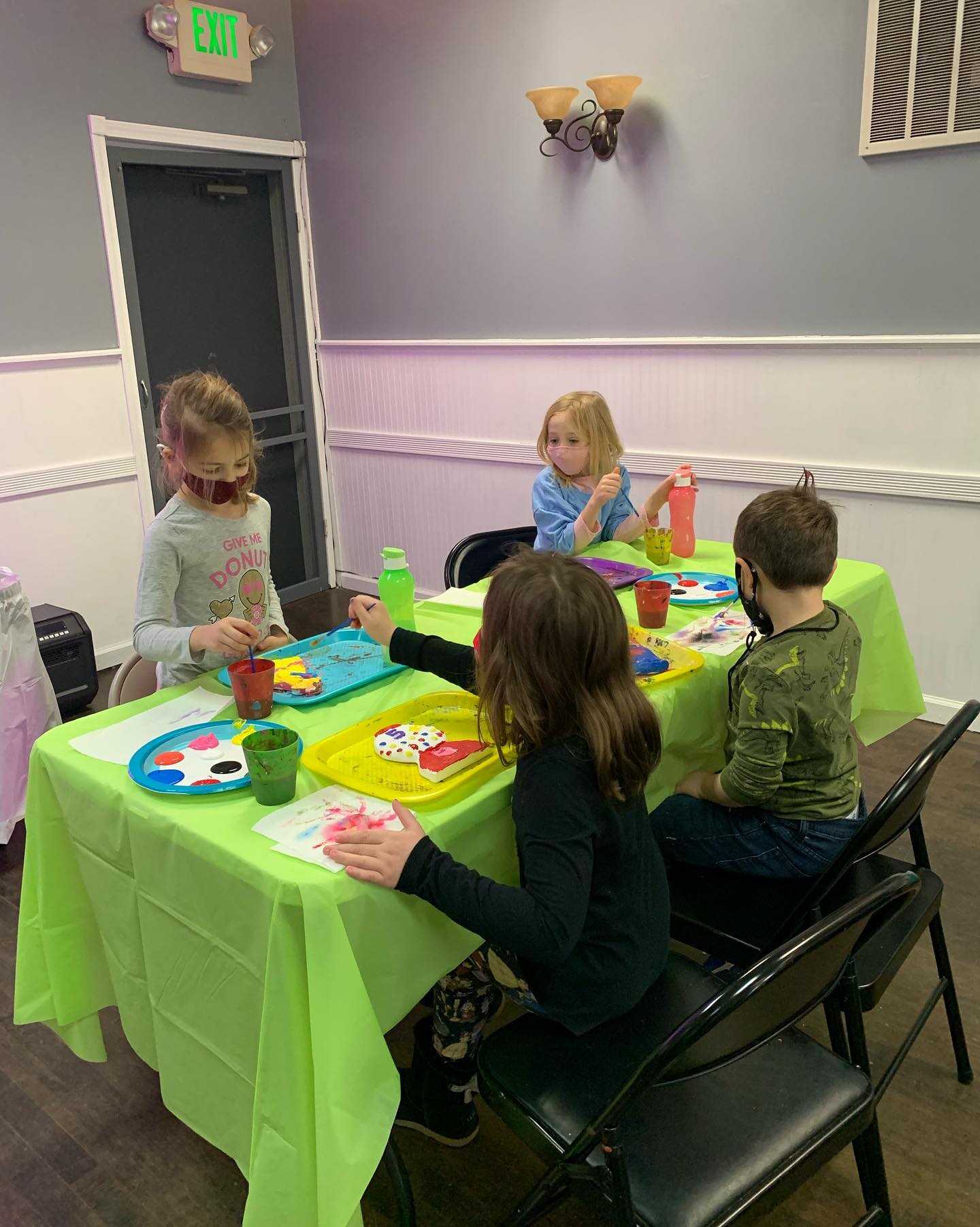 Kids painting during plaster paint party