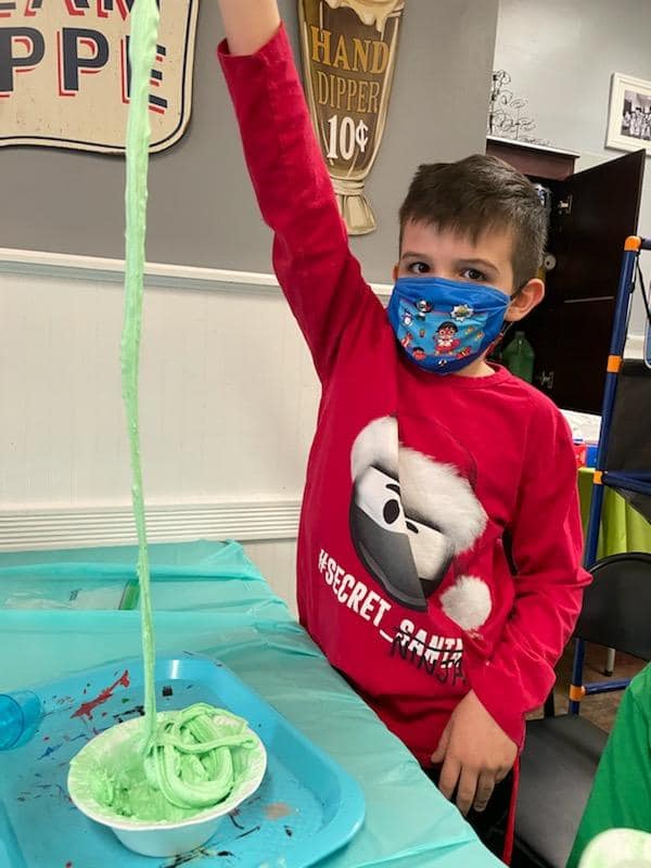 Boy in mask at slime party