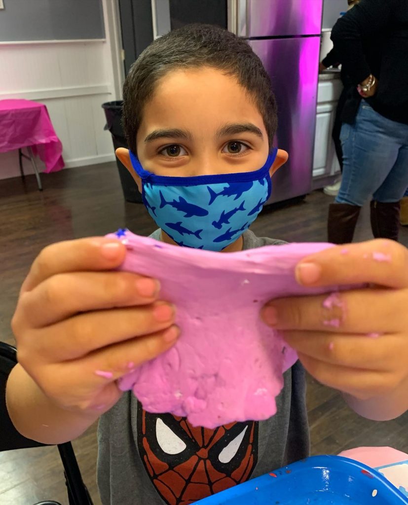 Boy in mask making slime