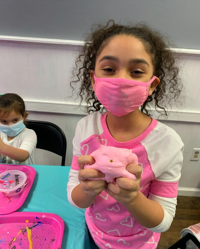 Girl in mask making slime