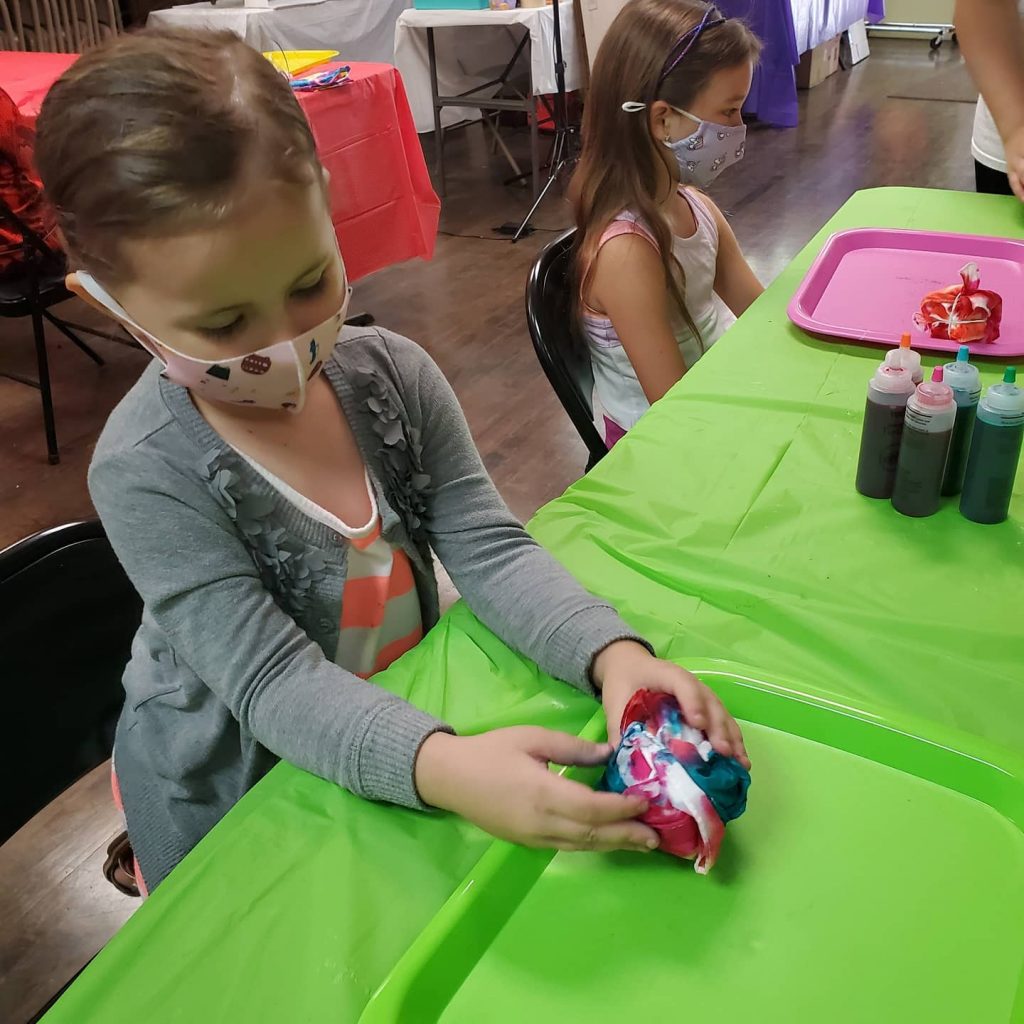 Girl making tie dye at A Sprinkle of Fun