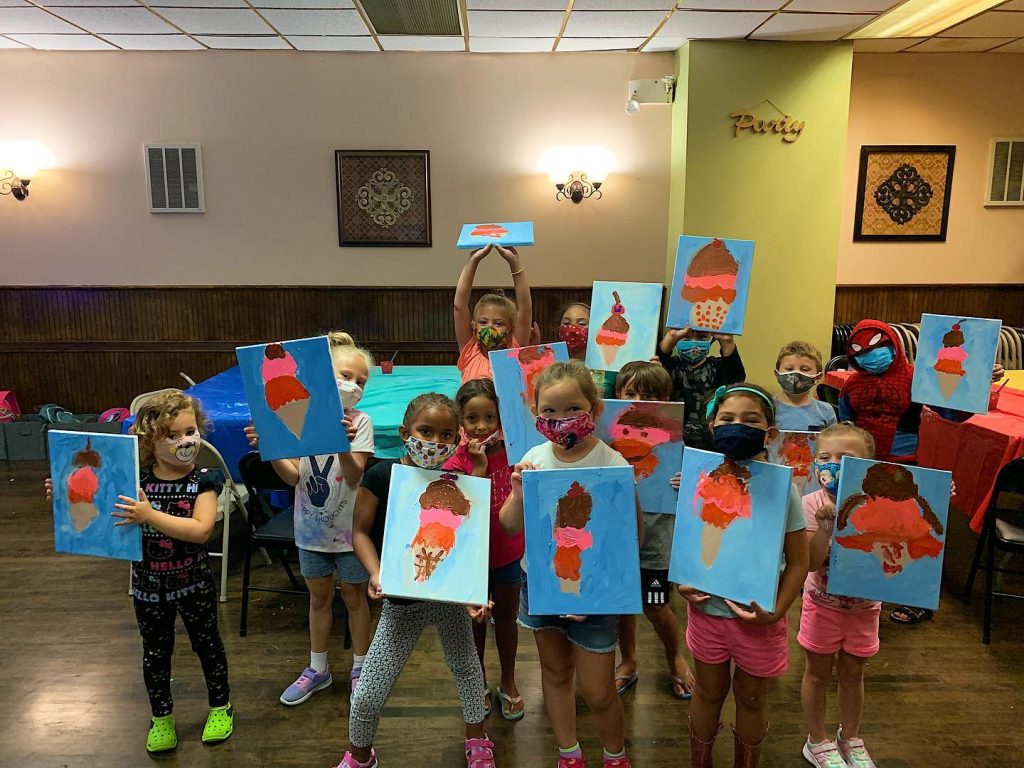 Children in masks showing ice cream canvas paintings