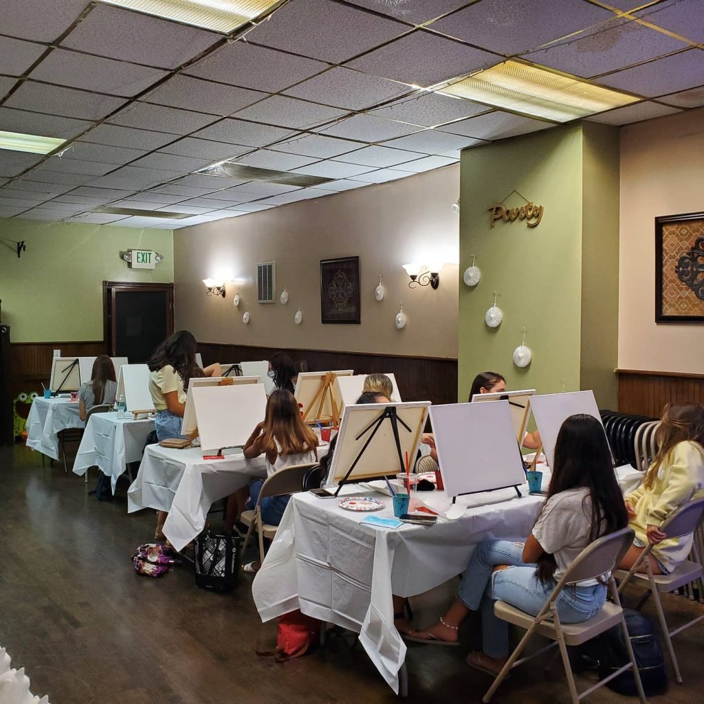 Young ladies canvas paint and sip party