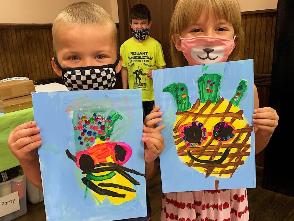 Kids in masks showing pineapple theme canvas art