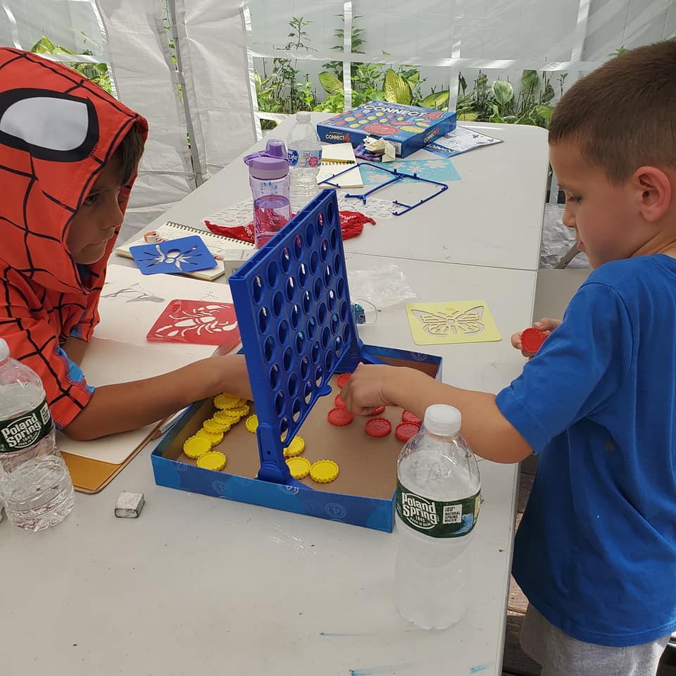 children playing board games